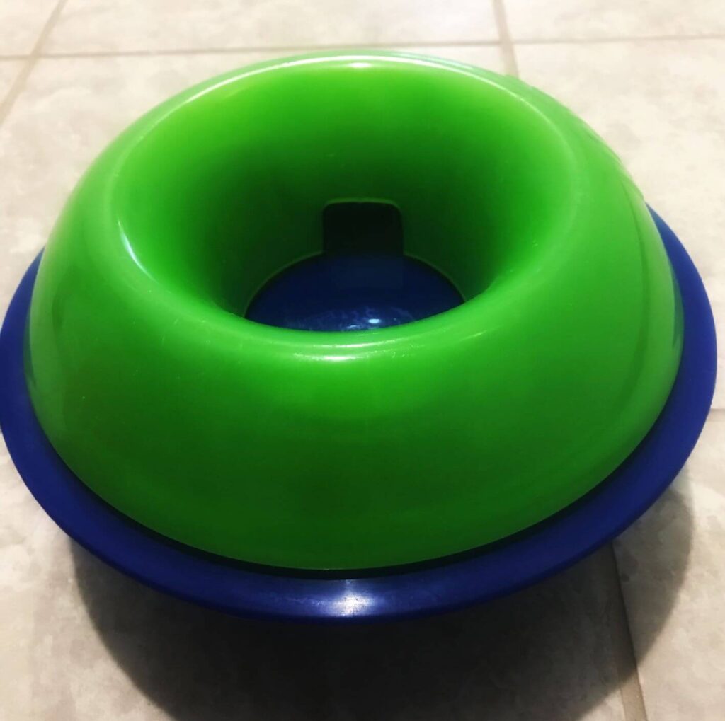 Blue and green puzzle feeder dog toy.